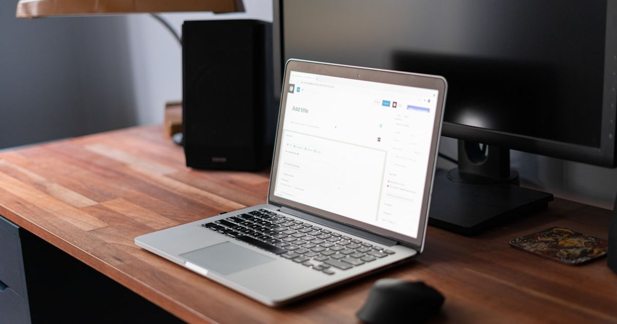 macbook pro on brown wooden table