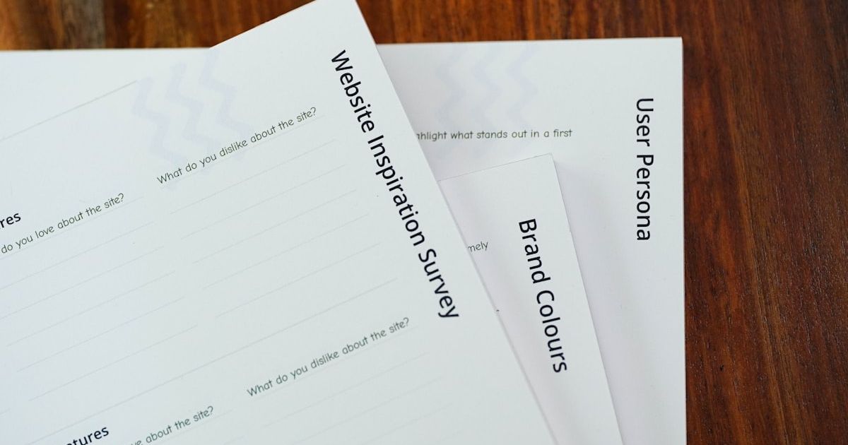 a close up of a stack of papers on a table