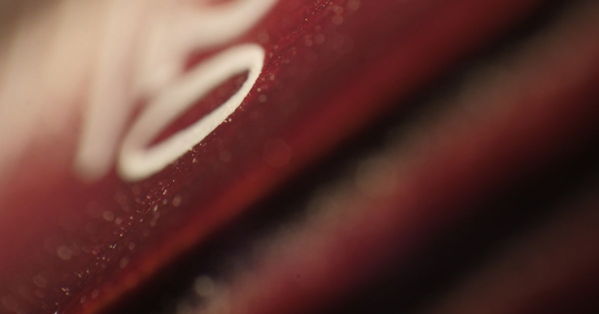 Close-up of a red surface with white markings.
